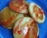 A picture of step 7 of Vanilla Pancakes with Strawberry Sauce.