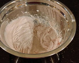 A picture of step 21 of White Layer Cake with a Raspberry Swirl Cheesecake center layer and a Raspberry Cream Frosting.