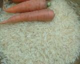 A picture of step 1 of Rice with carrot and sauce.