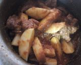 A picture of step 8 of Alu Gosht.