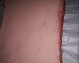 A picture of step 8 of Strawberry milk cake with whipped cream frosting.