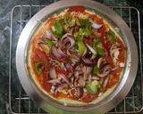 A picture of step 9 of Capsicum Onion Cheese Pizza.