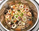 A picture of step 7 of Bacon, seafood bamboo seasoned rice.