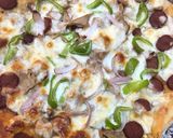 A picture of step 8 of Sausage pizza.