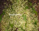 A picture of step 1 of Neem Phool ki Subzi.