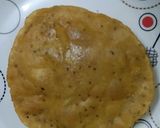A picture of step 4 of Kashmiri Khatte Baigan with Khasta Puri.