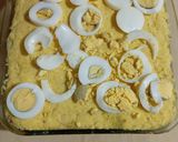 A picture of step 5 of Causa with Mackerel and Avocado.