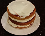 A picture of step 22 of Vanilla Lemon Raspberry Layer Cake with Whipped Cream Buttercream Frosting.