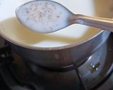 A picture of step 4 of Broken Wheat Kheer with pumpkin seeds.