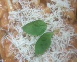 A picture of step 2 of Green and pink sauce backed pasta.