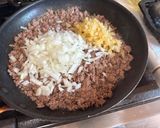 A picture of step 2 of Cheeseburger Spring Rolls.