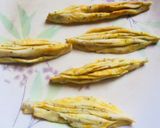 A picture of step 8 of #Karela,fish,layers,flower,  net and triangle shaped Nimkis.