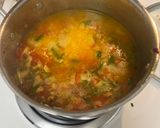 A picture of step 7 of Yellow Rice with Jalapeños and Tomatoes.