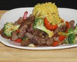A picture of step 4 of Lomo Saltado with Broccoli and Red Bell Pepper.