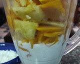 A picture of step 1 of Pineapple and mango smoothie, with ice cream.