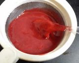 A picture of step 5 of Strawberry milk shake with dollop of strawberry ice cream.