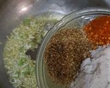 A picture of step 2 of Dam allu with colourful zeera rice.