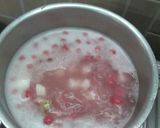 A picture of step 7 of Hibiscus Thai rice balls dunk in coconut milk.