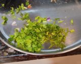 A picture of step 1 of Daki sawal of yesterday rice with fruit ginger, small onion,green chilli and tadka.