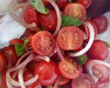 A picture of step 4 of Tomato, red onion, basil and balsamic salad.