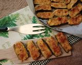 Foto del passaggio 3 della ricetta Zucchine Ripiene Ricotta Pomodori Secchi Capperi Prosciutto Cotto Scamorza Affumicata