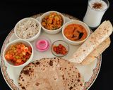 A picture of step 8 of NORTH INDIAN THALI For lunch mutter -paneer, aloo gobhi, moong dal tadka,jeera rice,pickle, roti.