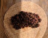 A picture of step 4 of Enchiladas with black bean mole.