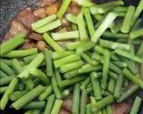 A picture of step 4 of Stir-Fried Garlic Scapes with Pork Belly.