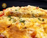 A picture of step 8 of Cheese Burst Veggies And Chicken Pizza From Scratch.