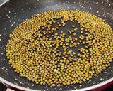 A picture of step 1 of Green moong- jaggery ladoos (saboot moong- gur ke laddoo).