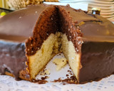 Foto del paso 11 de la receta: Bizcocho de leche condensada y cacao con cobertura de chocolate