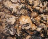 A picture of step 5 of Chicken Marsala.