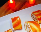 A picture of step 14 of Orange Marble Swiss Roll.