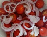 A picture of step 2 of Tomato, red onion, basil and balsamic salad.