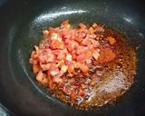 A picture of step 2 of Masala laccha paratha with aloo matar in tomato gravy.