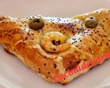 Foto del paso 7 de la receta: Empanadas de hojaldre rellenas de langostinos, queso, champiñones y aceitunas