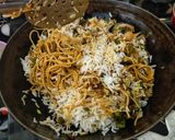A picture of step 4 of Triple Schezwan fried rice.