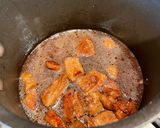 A picture of step 2 of Braised Pork with Young Coconut.