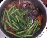 A picture of step 5 of Dinengdeng with fried fish.