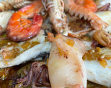 Foto del paso 7 de la receta: Merluza al horno con chipirones 🦑 patatas, mejillones y almejas