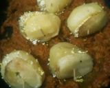 A picture of step 8 of Paneer stuffed potatoes in masala gravy.
