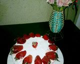 A picture of step 4 of Whipped cream frosting with strawberry.
