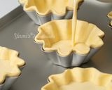 A picture of step 12 of Mini Flower-Shaped Portuguese Egg Tarts with Puff Pastry.