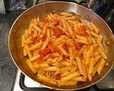 A picture of step 8 of Penne al'arrabiata (pasta with a spicy tomato sauce).