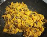 A picture of step 5 of Kumror Chakka Vegan pumpkin curry with black chickpeas.