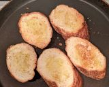 A picture of step 4 of Moong and Chana Hummus on toasted bread.