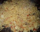 A picture of step 5 of Indomie with potato and dried fish.