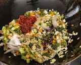 A picture of step 3 of Triple Schezwan fried rice.