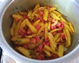 A picture of step 7 of Dry potatoe curry#cookingwith Tomatoescontest.