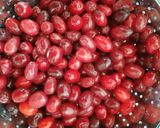 A picture of step 1 of Persian Pickled Cornelian Cherries.